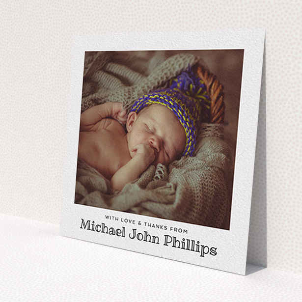 A baby thank you card design called 'Simple Photo Frame'. It is a square (148mm x 148mm) card in a square orientation. It is a photographic baby thank you card with room for 1 photo. 'Simple Photo Frame' is available as a flat card, with mainly white colouring.