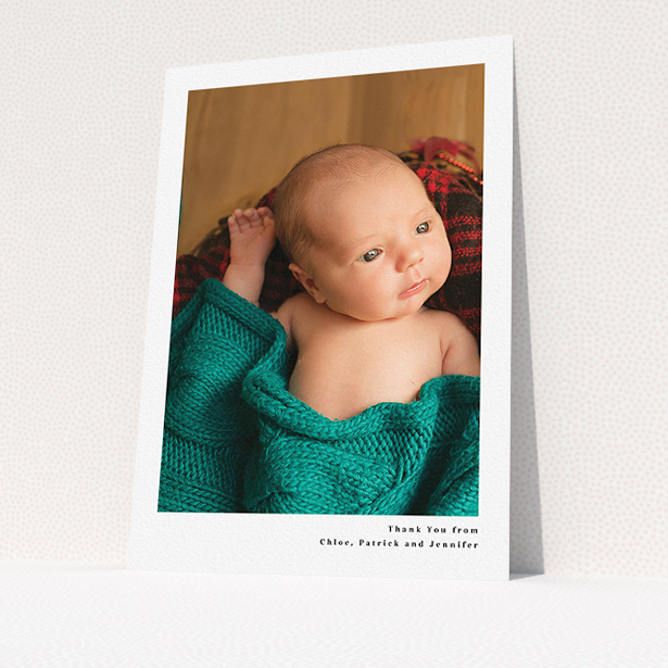 A baby thank you card design called "Simple Portrait". It is an A5 card in a portrait orientation. It is a photographic baby thank you card with room for 1 photo. "Simple Portrait" is available as a flat card, with mainly white colouring.