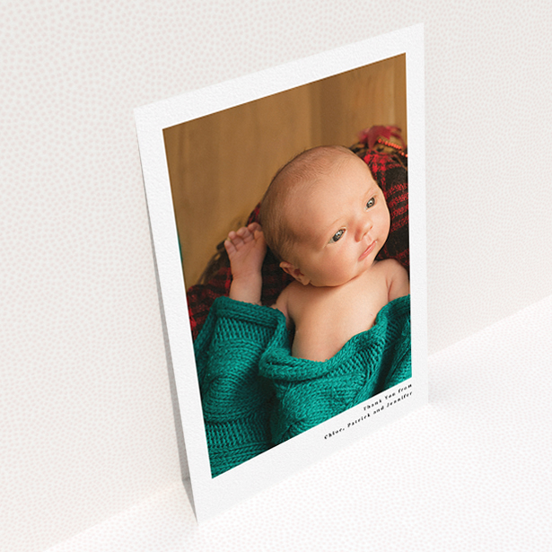 A baby thank you card design called "Simple Portrait". It is an A5 card in a portrait orientation. It is a photographic baby thank you card with room for 1 photo. "Simple Portrait" is available as a flat card, with mainly white colouring.