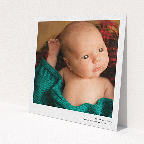 A baby thank you card named 'Simple Portrait'. It is a square (148mm x 148mm) card in a square orientation. It is a photographic baby thank you card with room for 1 photo. 'Simple Portrait' is available as a flat card, with mainly white colouring.