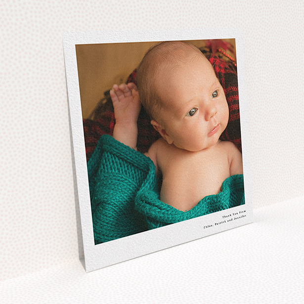 A baby thank you card named "Simple Portrait". It is a square (148mm x 148mm) card in a square orientation. It is a photographic baby thank you card with room for 1 photo. "Simple Portrait" is available as a flat card, with mainly white colouring.