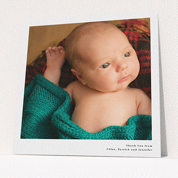 A baby thank you card named "Simple Portrait". It is a square (148mm x 148mm) card in a square orientation. It is a photographic baby thank you card with room for 1 photo. "Simple Portrait" is available as a flat card, with mainly white colouring.