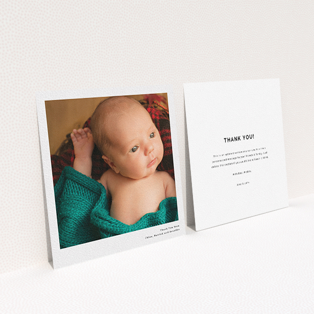 A baby thank you card named "Simple Portrait". It is a square (148mm x 148mm) card in a square orientation. It is a photographic baby thank you card with room for 1 photo. "Simple Portrait" is available as a flat card, with mainly white colouring.