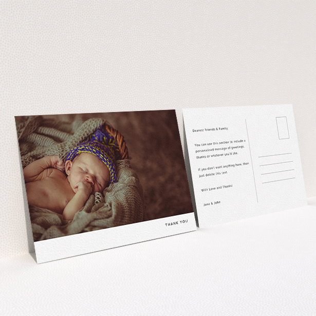 A baby thank you card named "Thankful with Simplicity". It is an A6 card in a landscape orientation. It is a photographic baby thank you card with room for 1 photo. "Thankful with Simplicity" is available as a flat card, with mainly white colouring.
