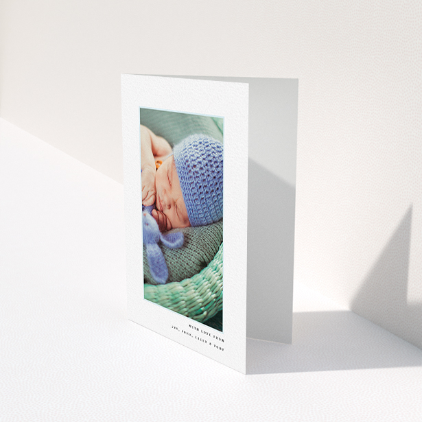 A baby thank you card template titled "Thin Blue Frame". It is an A6 card in a portrait orientation. It is a photographic baby thank you card with room for 1 photo. "Thin Blue Frame" is available as a folded card, with tones of white and blue.