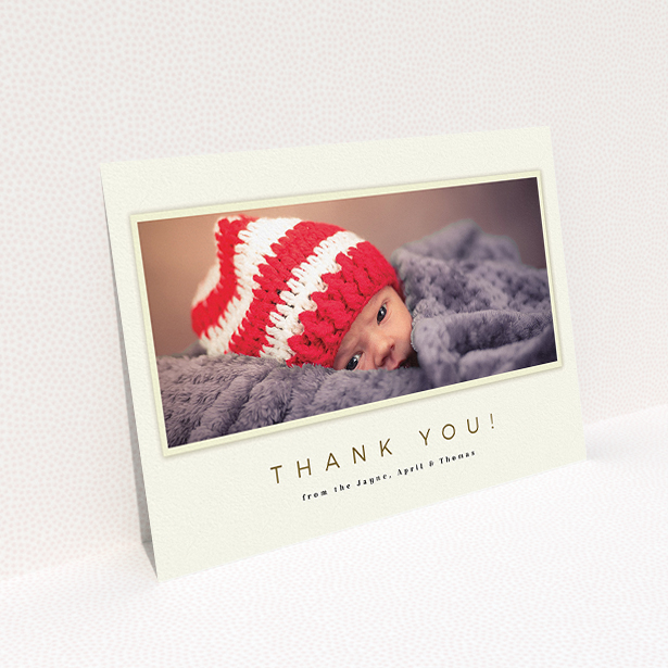 A baby thank you card named "Torn Cream Frame". It is an A5 card in a landscape orientation. It is a photographic baby thank you card with room for 1 photo. "Torn Cream Frame" is available as a flat card, with mainly cream colouring.