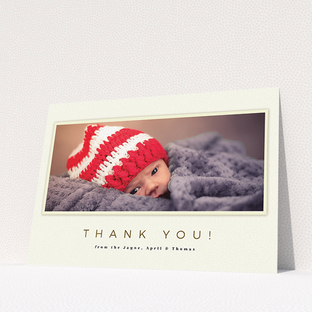 A baby thank you card named "Torn Cream Frame". It is an A5 card in a landscape orientation. It is a photographic baby thank you card with room for 1 photo. "Torn Cream Frame" is available as a flat card, with mainly cream colouring.