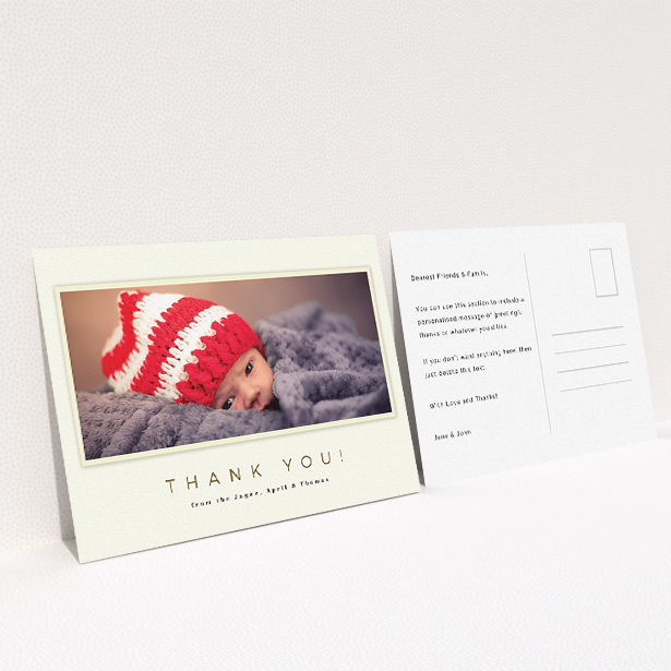 A baby thank you card named "Torn Cream Frame". It is an A5 card in a landscape orientation. It is a photographic baby thank you card with room for 1 photo. "Torn Cream Frame" is available as a flat card, with mainly cream colouring.