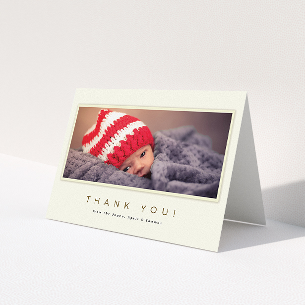 A baby thank you card template titled 'Torn Cream Frame'. It is an A5 card in a landscape orientation. It is a photographic baby thank you card with room for 1 photo. 'Torn Cream Frame' is available as a folded card, with mainly cream colouring.
