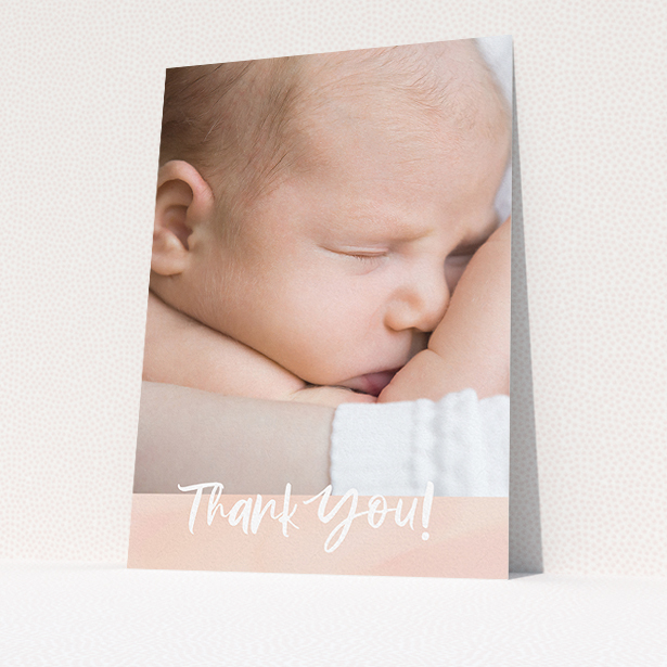 A baby thank you card design titled "Watercolour Thanks". It is an A5 card in a portrait orientation. It is a photographic baby thank you card with room for 1 photo. "Watercolour Thanks" is available as a flat card, with tones of pink and white.