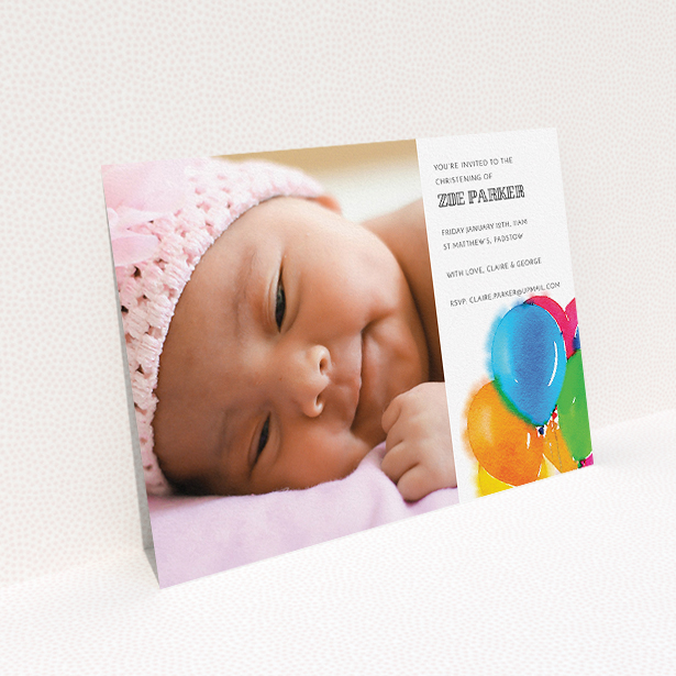 A baptism invitation called "Big Balloons". It is an A5 invite card in a landscape orientation. It is a photographic baptism invitation with room for 1 photo. "Big Balloons" is available as a flat invite card, with tones of white, orange and blue.