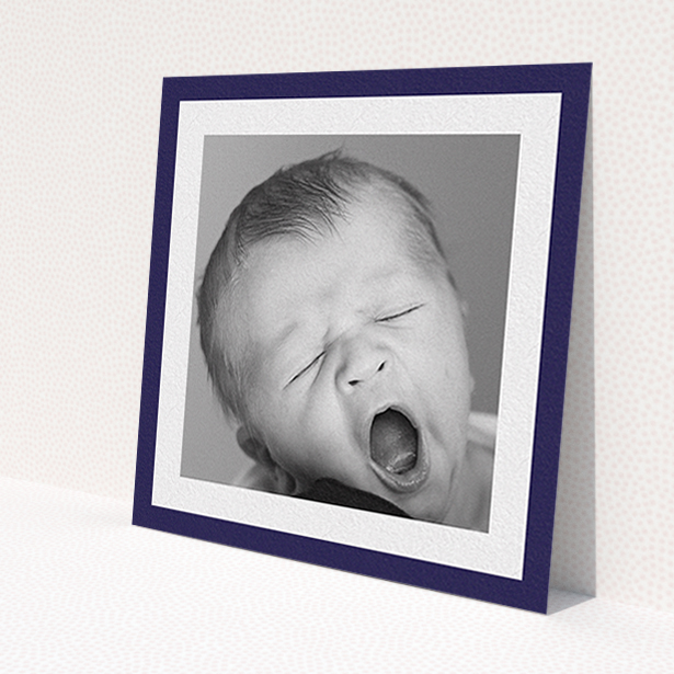 A baptism invitation design named 'Classic Navy Photo Frame'. It is a square (148mm x 148mm) invite card in a square orientation. It is a photographic baptism invitation with room for 1 photo. 'Classic Navy Photo Frame' is available as a flat invite card, with tones of blue and white.