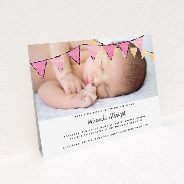 A baptism invitation design titled "Pink Bunting". It is an A5 invite card in a landscape orientation. It is a photographic baptism invitation with room for 1 photo. "Pink Bunting" is available as a flat invite card, with tones of pink and white.