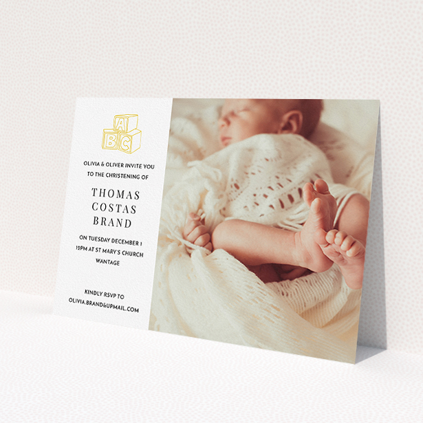 A baptism invitation design named 'Playtime'. It is an A5 invite card in a landscape orientation. It is a photographic baptism invitation with room for 1 photo. 'Playtime' is available as a flat invite card, with tones of white and yellow.