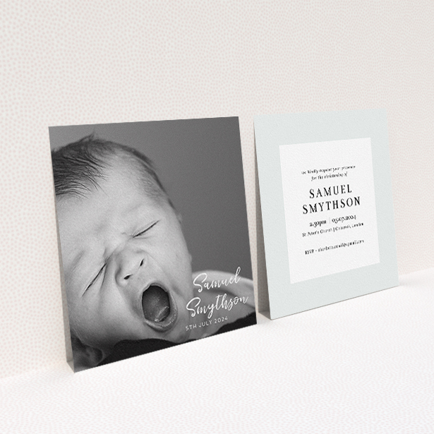 A baptism invitation called "Soho Script". It is a square (148mm x 148mm) invite card in a square orientation. It is a photographic baptism invitation with room for 1 photo. "Soho Script" is available as a flat invite card, with mainly white colouring.