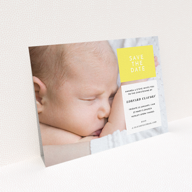 A baptism invitation design titled "Two Frames". It is an A6 invite card in a landscape orientation. It is a photographic baptism invitation with room for 1 photo. "Two Frames" is available as a flat invite card, with tones of yellow and white.