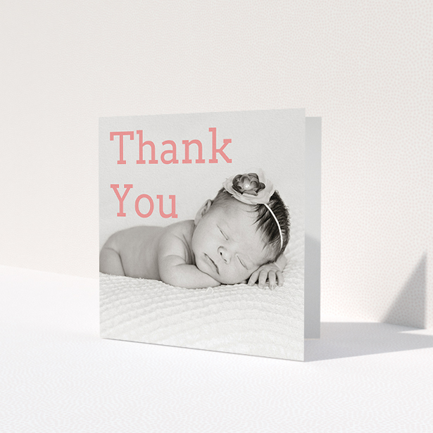 A baptism thank you card design called 'Big Thanks'. It is a square (148mm x 148mm) card in a square orientation. It is a photographic baptism thank you card with room for 1 photo. 'Big Thanks' is available as a folded card, with mainly light pink colouring.