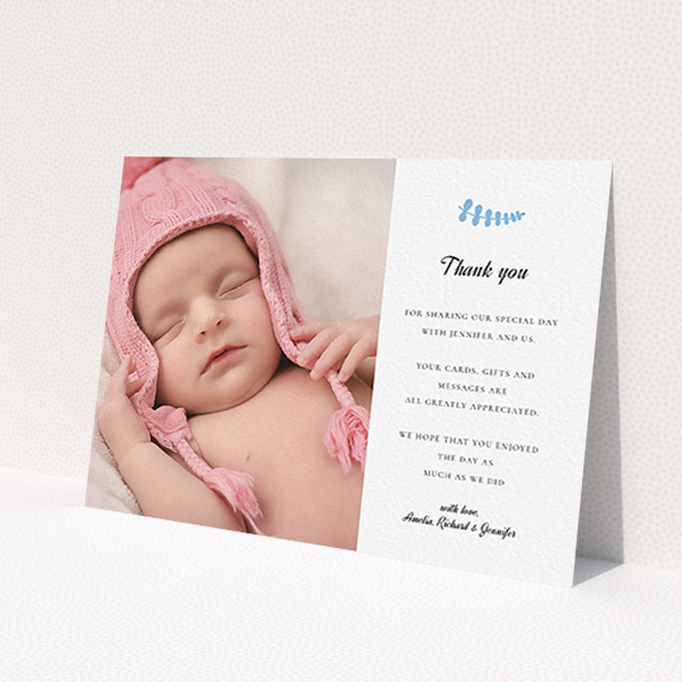 A baptism thank you card template titled 'Blue Fern'. It is an A6 card in a landscape orientation. It is a photographic baptism thank you card with room for 1 photo. 'Blue Fern' is available as a flat card, with tones of white and blue.