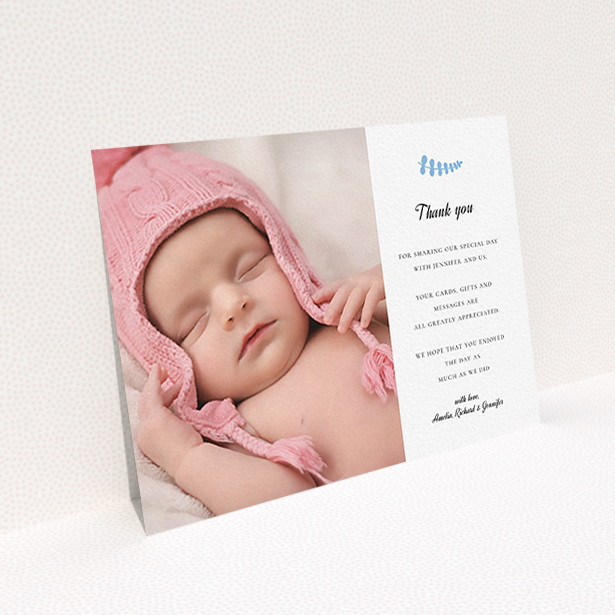 A baptism thank you card template titled "Blue Fern". It is an A6 card in a landscape orientation. It is a photographic baptism thank you card with room for 1 photo. "Blue Fern" is available as a flat card, with tones of white and blue.