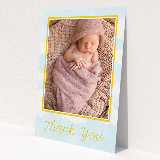 A baptism thank you card design named 'Blue Skies'. It is an A5 card in a portrait orientation. It is a photographic baptism thank you card with room for 1 photo. 'Blue Skies' is available as a flat card, with tones of blue, yellow and white.
