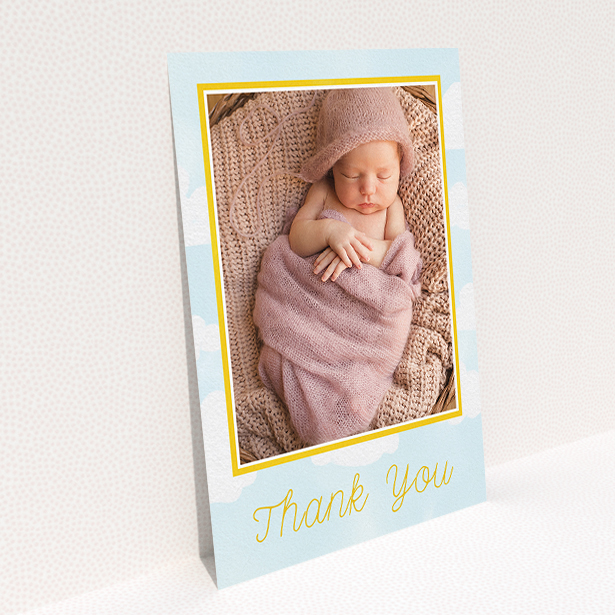 A baptism thank you card design named "Blue Skies". It is an A5 card in a portrait orientation. It is a photographic baptism thank you card with room for 1 photo. "Blue Skies" is available as a flat card, with tones of blue, yellow and white.