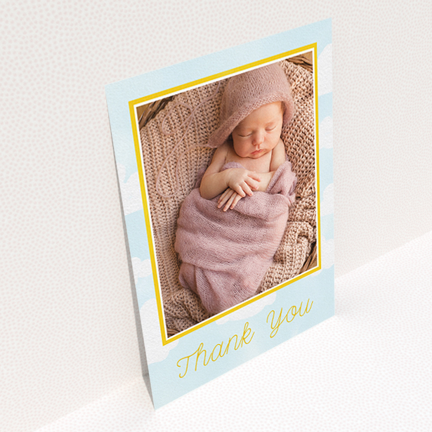 A baptism thank you card design named "Blue Skies". It is an A5 card in a portrait orientation. It is a photographic baptism thank you card with room for 1 photo. "Blue Skies" is available as a flat card, with tones of blue, yellow and white.
