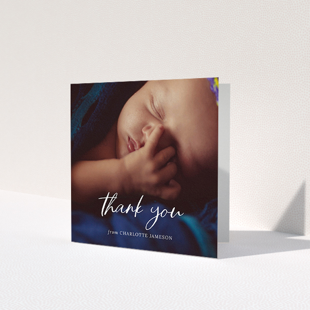 A baptism thank you card template titled 'Calligraphy Thanks'. It is a square (148mm x 148mm) card in a square orientation. It is a photographic baptism thank you card with room for 1 photo. 'Calligraphy Thanks' is available as a folded card, with mainly white colouring.