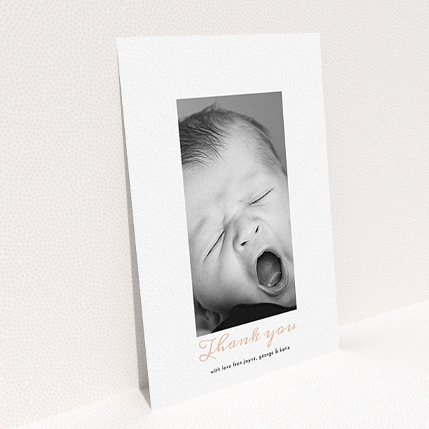 A baptism thank you card design called "Central Portrait". It is an A6 card in a portrait orientation. It is a photographic baptism thank you card with room for 1 photo. "Central Portrait" is available as a flat card, with tones of white and pink.