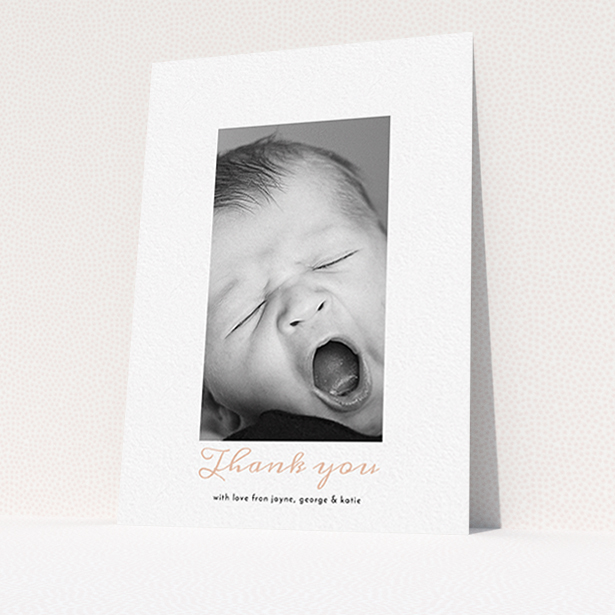 A baptism thank you card design called "Central Portrait". It is an A6 card in a portrait orientation. It is a photographic baptism thank you card with room for 1 photo. "Central Portrait" is available as a flat card, with tones of white and pink.