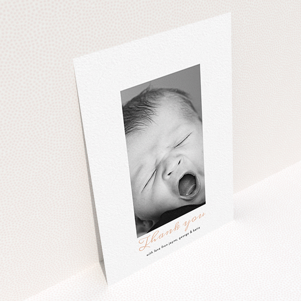 A baptism thank you card design called "Central Portrait". It is an A6 card in a portrait orientation. It is a photographic baptism thank you card with room for 1 photo. "Central Portrait" is available as a flat card, with tones of white and pink.