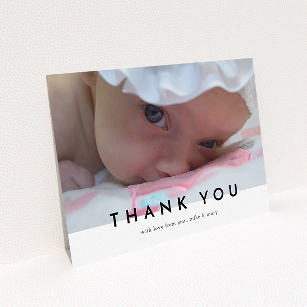 A baptism thank you card design named "Cross Border". It is an A5 card in a landscape orientation. It is a photographic baptism thank you card with room for 1 photo. "Cross Border" is available as a flat card, with mainly white colouring.