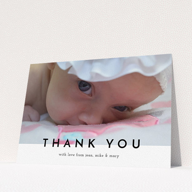 A baptism thank you card design named "Cross Border". It is an A5 card in a landscape orientation. It is a photographic baptism thank you card with room for 1 photo. "Cross Border" is available as a flat card, with mainly white colouring.