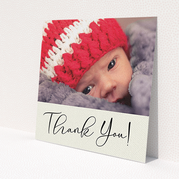 A baptism thank you card named 'Cursive Thanks'. It is a square (148mm x 148mm) card in a square orientation. It is a photographic baptism thank you card with room for 1 photo. 'Cursive Thanks' is available as a flat card, with mainly cream colouring.