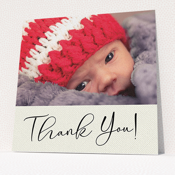 A baptism thank you card named "Cursive Thanks". It is a square (148mm x 148mm) card in a square orientation. It is a photographic baptism thank you card with room for 1 photo. "Cursive Thanks" is available as a flat card, with mainly cream colouring.
