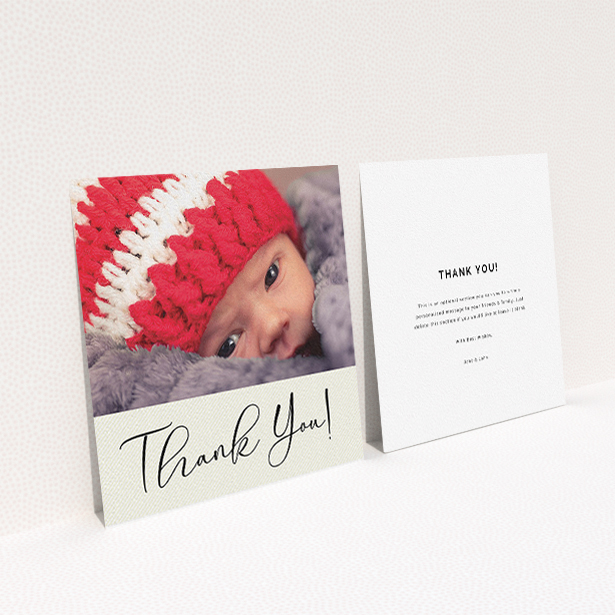 A baptism thank you card named "Cursive Thanks". It is a square (148mm x 148mm) card in a square orientation. It is a photographic baptism thank you card with room for 1 photo. "Cursive Thanks" is available as a flat card, with mainly cream colouring.