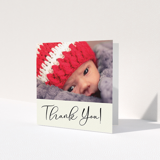 A baptism thank you card design called 'Cursive Thanks'. It is a square (148mm x 148mm) card in a square orientation. It is a photographic baptism thank you card with room for 1 photo. 'Cursive Thanks' is available as a folded card, with mainly cream colouring.