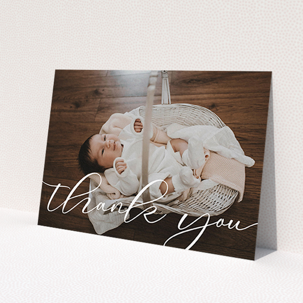 A baptism thank you card design called 'One Photo'. It is an A6 card in a landscape orientation. It is a photographic baptism thank you card with room for 1 photo. 'One Photo' is available as a flat card, with mainly white colouring.