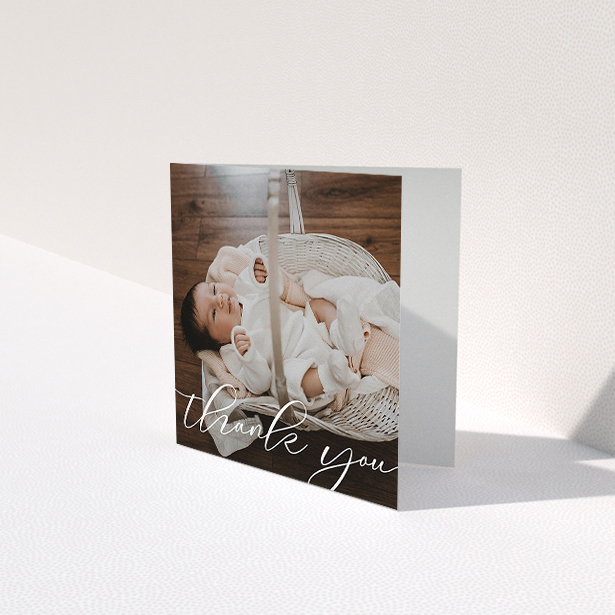 A baptism thank you card named "One Photo". It is a square (148mm x 148mm) card in a square orientation. It is a photographic baptism thank you card with room for 1 photo. "One Photo" is available as a folded card, with mainly white colouring.