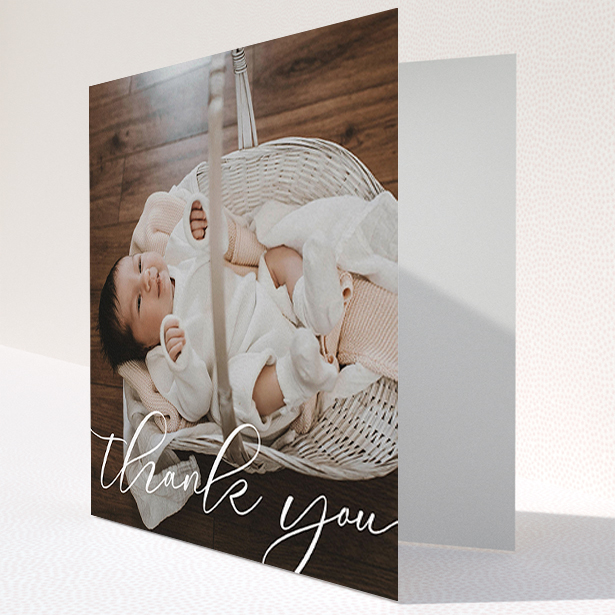 A baptism thank you card named "One Photo". It is a square (148mm x 148mm) card in a square orientation. It is a photographic baptism thank you card with room for 1 photo. "One Photo" is available as a folded card, with mainly white colouring.
