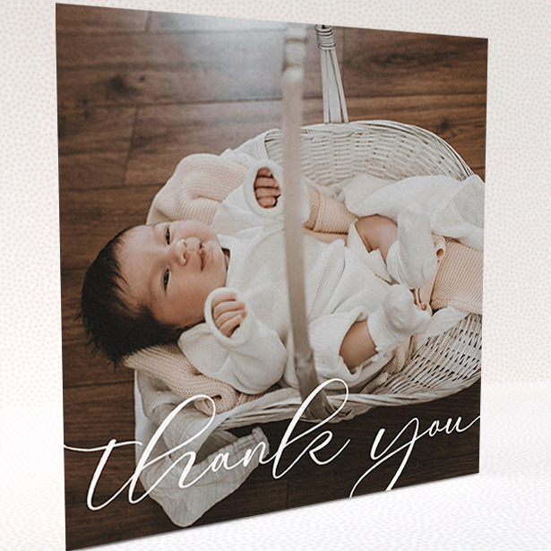 A baptism thank you card named "One Photo". It is a square (148mm x 148mm) card in a square orientation. It is a photographic baptism thank you card with room for 1 photo. "One Photo" is available as a folded card, with mainly white colouring.