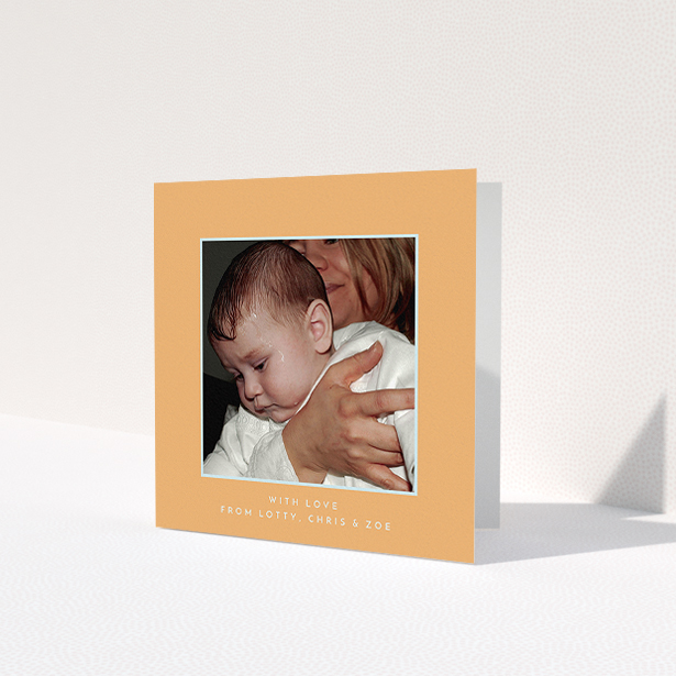 A baptism thank you card template titled 'Orange and Mint'. It is a square (148mm x 148mm) card in a square orientation. It is a photographic baptism thank you card with room for 1 photo. 'Orange and Mint' is available as a folded card, with tones of orange and blue.