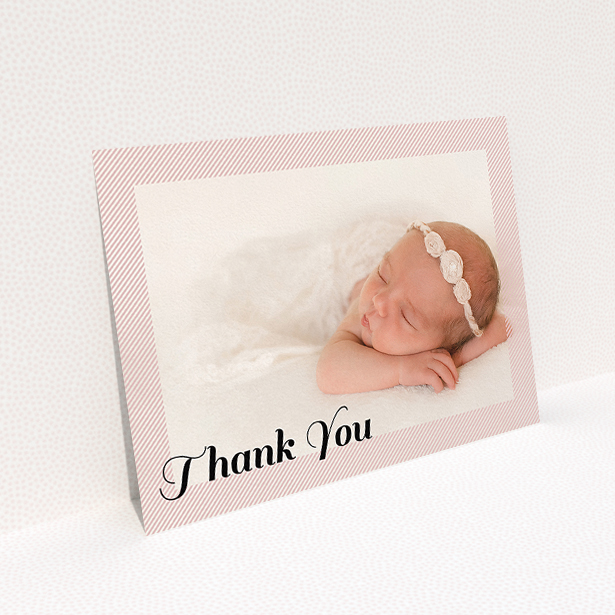 A baptism thank you card design named "Pastel Diagonals". It is an A5 card in a landscape orientation. It is a photographic baptism thank you card with room for 1 photo. "Pastel Diagonals" is available as a flat card, with mainly pink colouring.