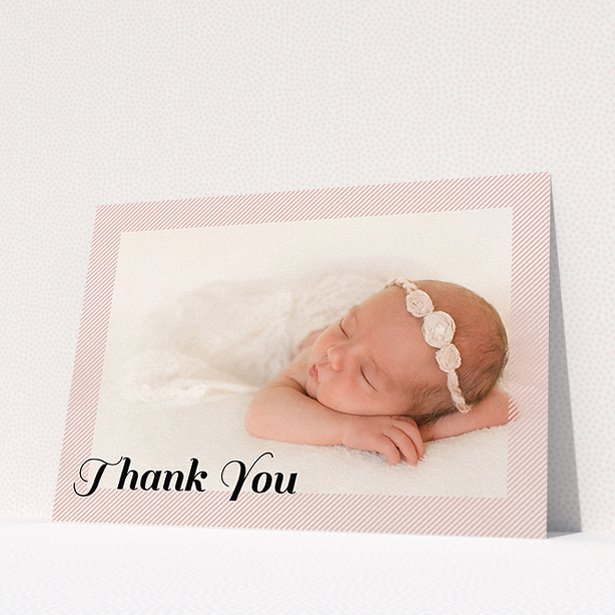A baptism thank you card design named "Pastel Diagonals". It is an A5 card in a landscape orientation. It is a photographic baptism thank you card with room for 1 photo. "Pastel Diagonals" is available as a flat card, with mainly pink colouring.