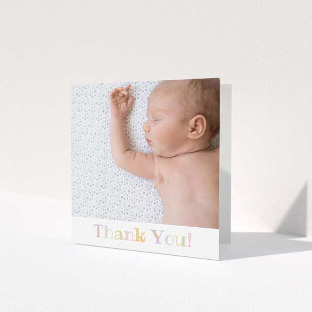 A baptism thank you card template titled 'Pastel Thank You'. It is a square (148mm x 148mm) card in a square orientation. It is a photographic baptism thank you card with room for 1 photo. 'Pastel Thank You' is available as a folded card, with tones of white and green.