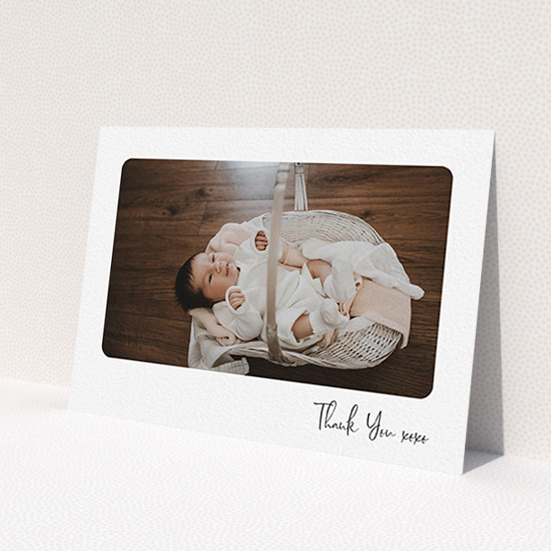 A baptism thank you card template titled 'Rounded Thanks'. It is an A6 card in a landscape orientation. It is a photographic baptism thank you card with room for 1 photo. 'Rounded Thanks' is available as a flat card, with mainly white colouring.