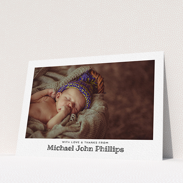 A baptism thank you card named "Simple Photo Frame". It is an A6 card in a landscape orientation. It is a photographic baptism thank you card with room for 1 photo. "Simple Photo Frame" is available as a flat card, with mainly white colouring.
