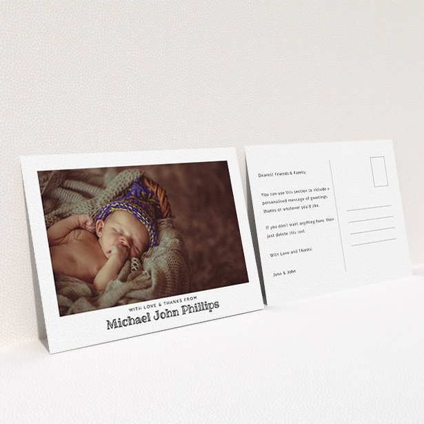A baptism thank you card named "Simple Photo Frame". It is an A6 card in a landscape orientation. It is a photographic baptism thank you card with room for 1 photo. "Simple Photo Frame" is available as a flat card, with mainly white colouring.