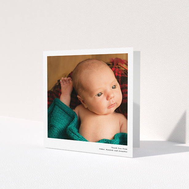 A baptism thank you card design titled 'Simple Portrait'. It is a square (148mm x 148mm) card in a square orientation. It is a photographic baptism thank you card with room for 1 photo. 'Simple Portrait' is available as a folded card, with mainly white colouring.