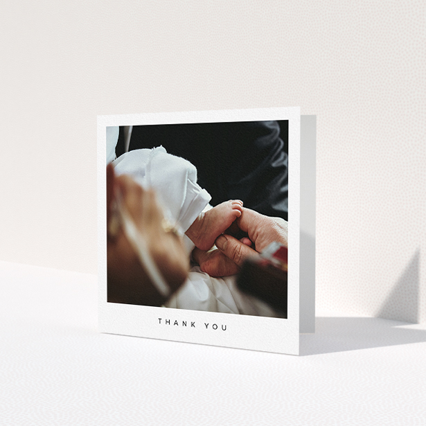 A baptism thank you card named 'Simple Thanks'. It is a square (148mm x 148mm) card in a square orientation. It is a photographic baptism thank you card with room for 1 photo. 'Simple Thanks' is available as a folded card, with mainly white colouring.