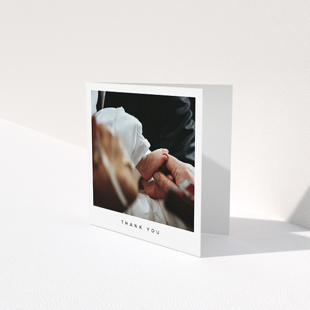 A baptism thank you card named "Simple Thanks". It is a square (148mm x 148mm) card in a square orientation. It is a photographic baptism thank you card with room for 1 photo. "Simple Thanks" is available as a folded card, with mainly white colouring.